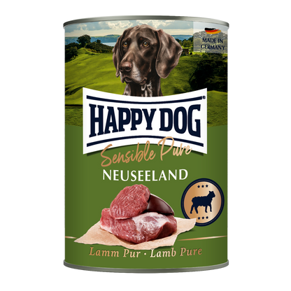 A can of Happy Dog Sensible Pure Neuseeland Lamb Pur dog food, featuring a green label with a German shepherd illustration, raw lamb meat, and a &